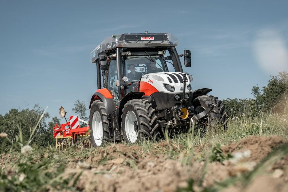 red tractor working in field