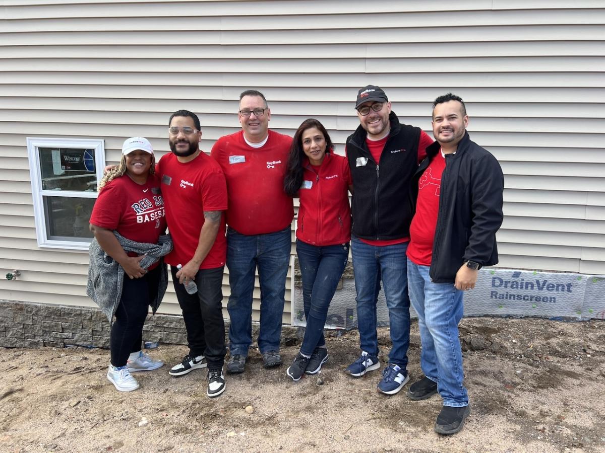 Habitat for Humanity and KeyBank volunteers shown in a group photo.