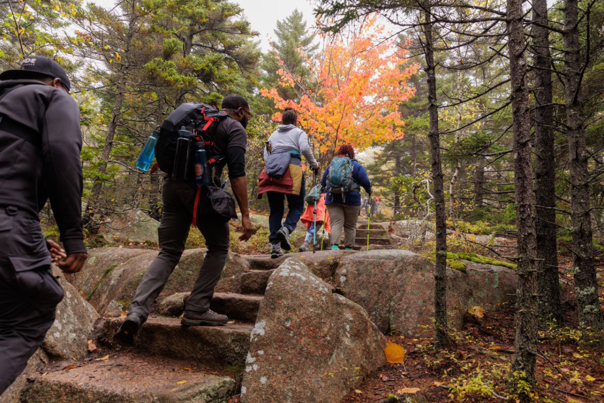 hikers climbing rock stairs