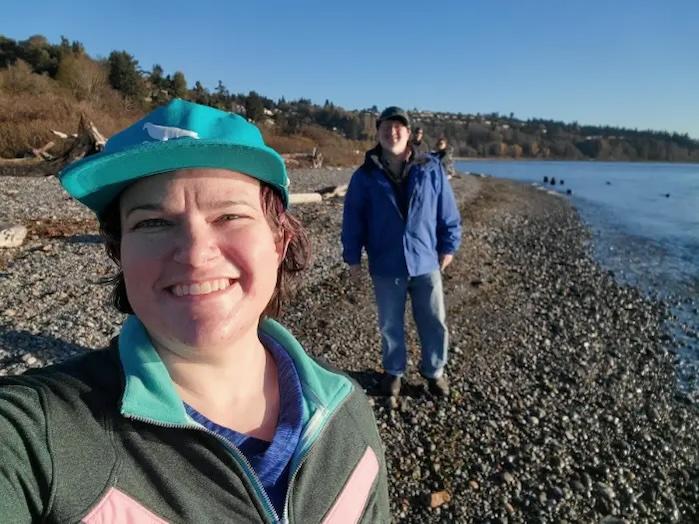 Hillary Jeffrey shown with her partner on the seashore.