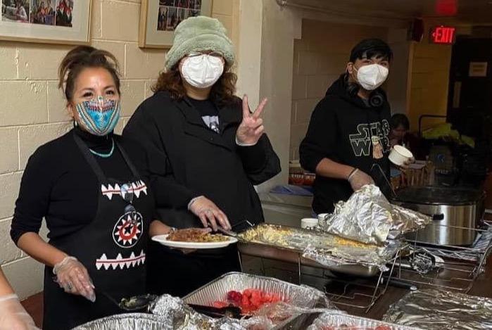 group of people wearing masks and smiling