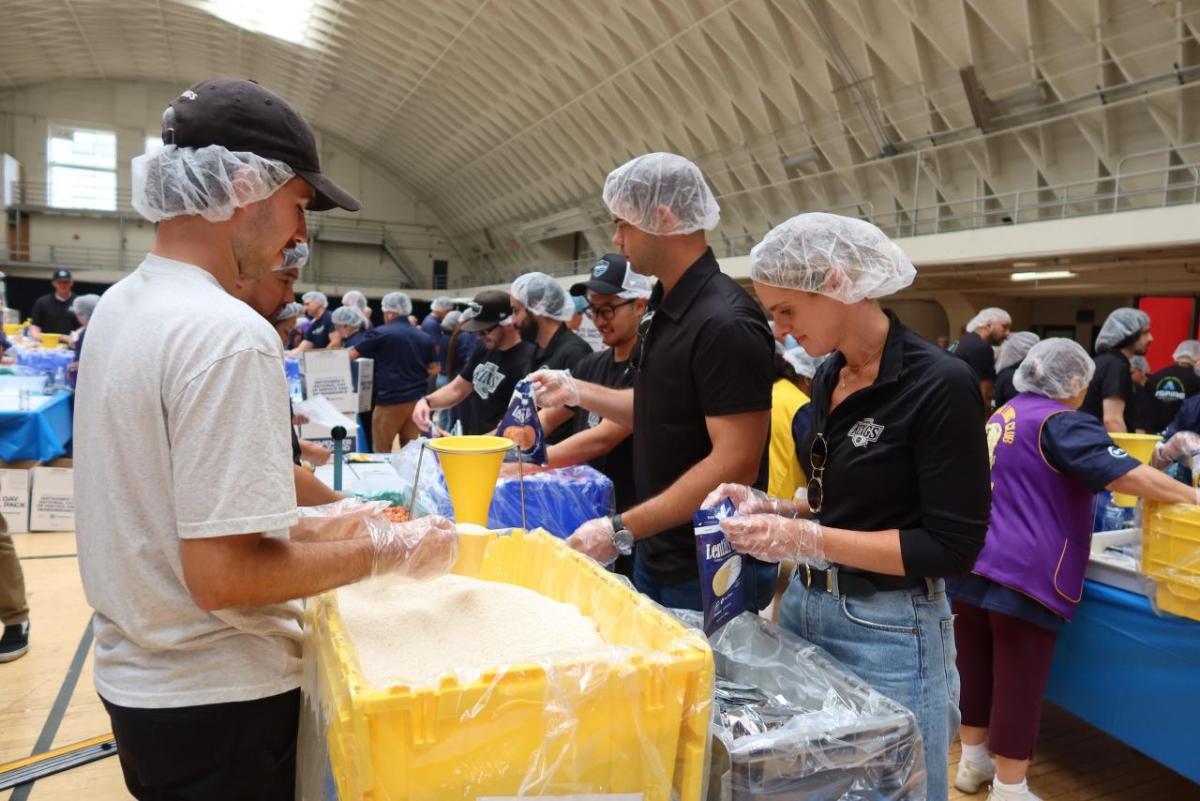 Volunteers from the LA Kings and Blue Shield of California gathered at the LAFD Frank Hotchkin Memorial Training Center to assemble meal kits for families in need.