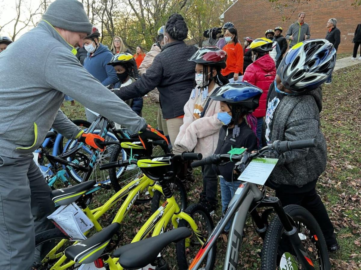 Kids in helmets with bikes