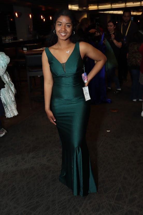 a woman posing in a prom dress