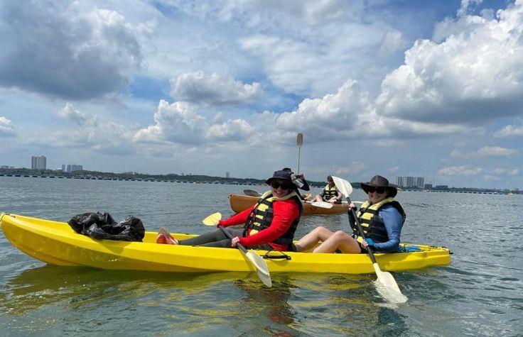 Two people paddling a canoe.