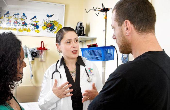 Dr. Lina Basel-Salmon consulting with two patients.