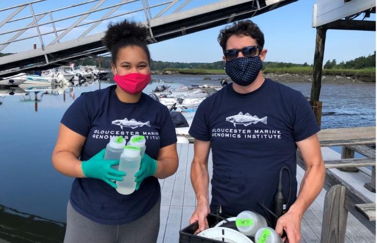 Research Scientist Tim O'Donnell teaches Gloucester Biotechnology Academy student Tamia Buckley proper water sampling techniques during her internship at GMGI.