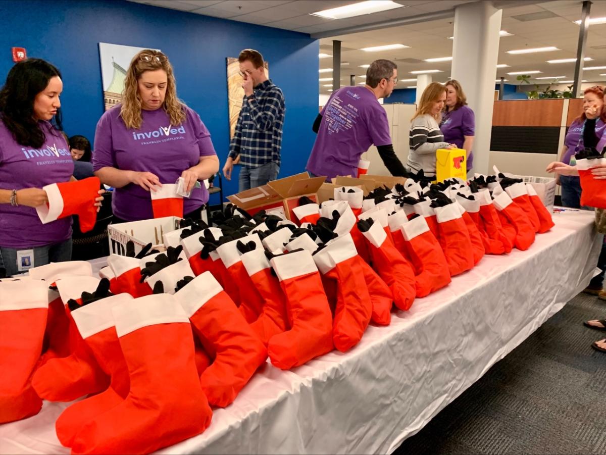 volunteers pack stockings full 