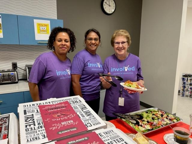 Three Short Hills volunteers serving food