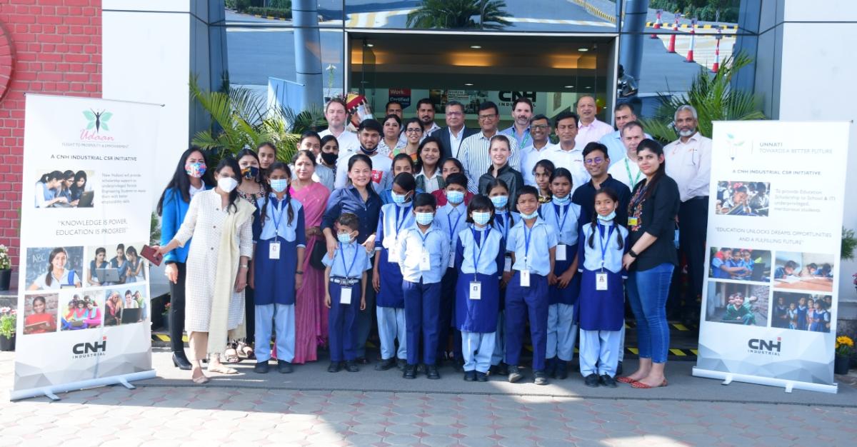 Class of students standing outside a school