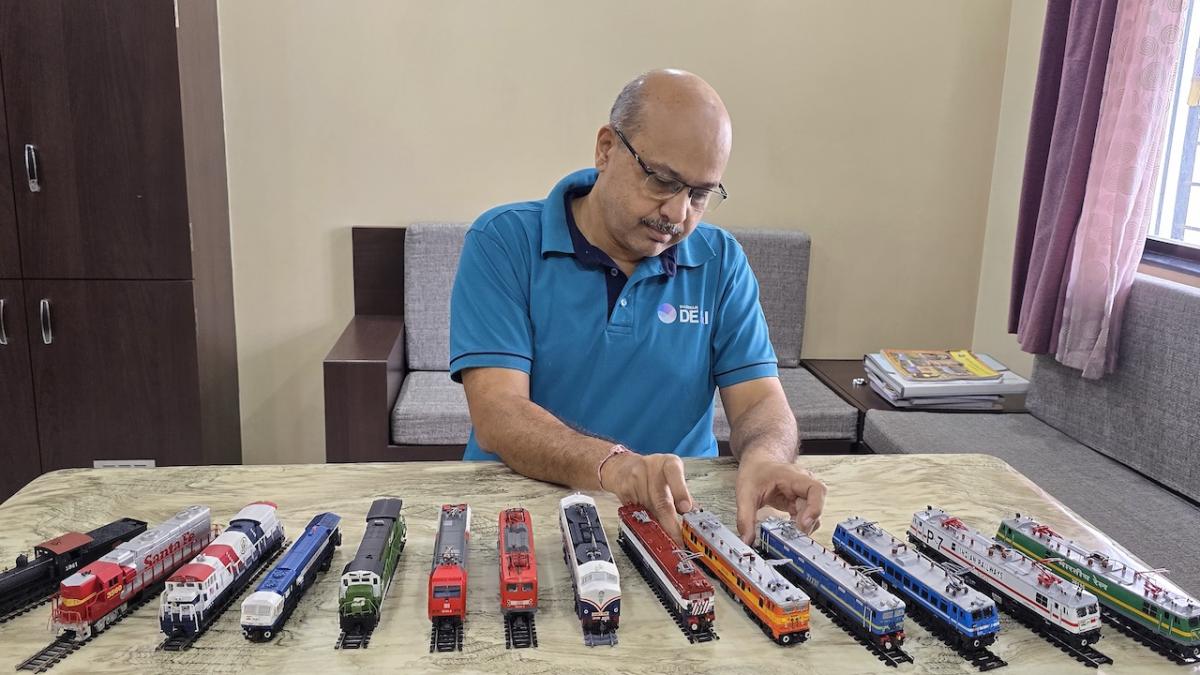 Abhay at work with his favorite hobby; model trains.