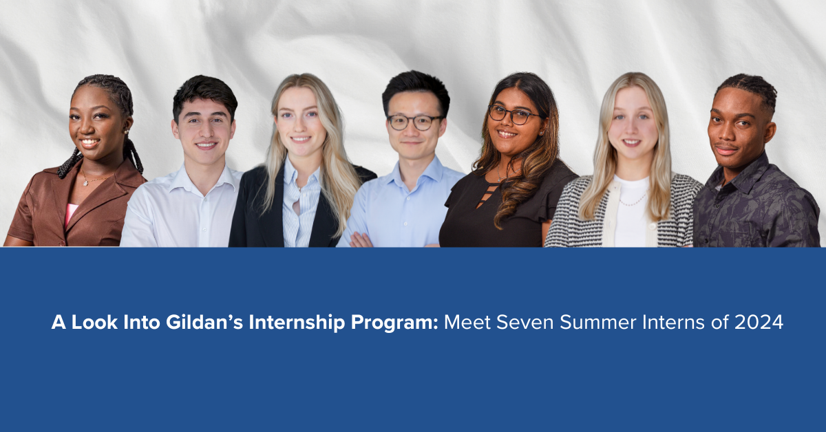 Seven interns pictured in front of a white fabric and blue background