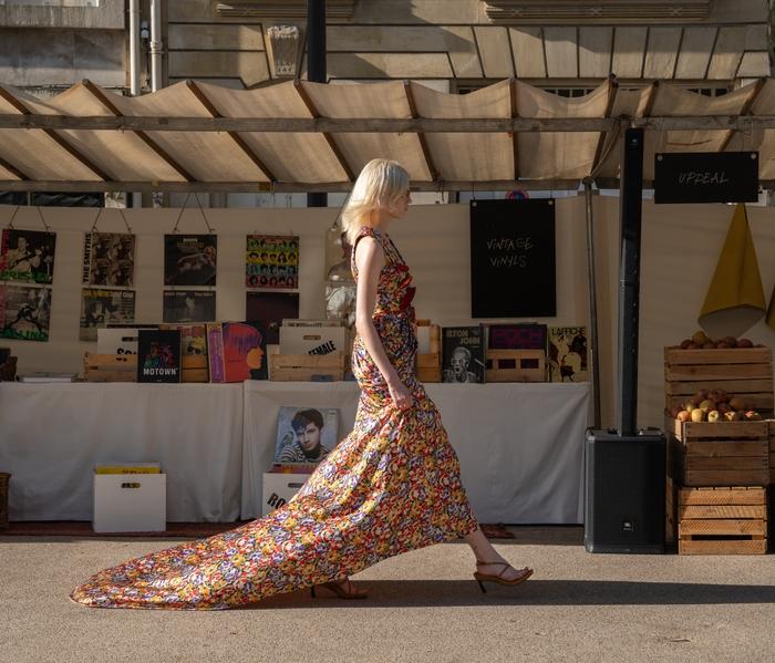 Model wearing one of Stella McCartney's floral dress creations in the Sustainable Market.