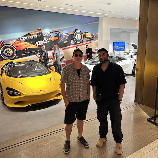 Jai Sharma and a friend looking at a Ferrari.