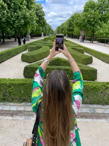 Jelena taking a selfie in a park.