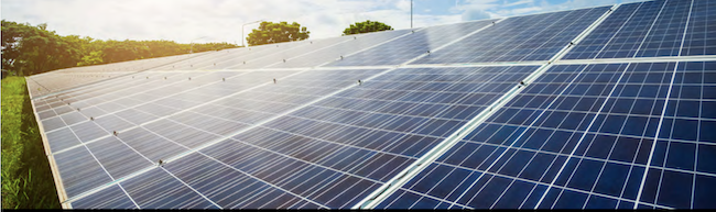 Solar panels against a blue sky.