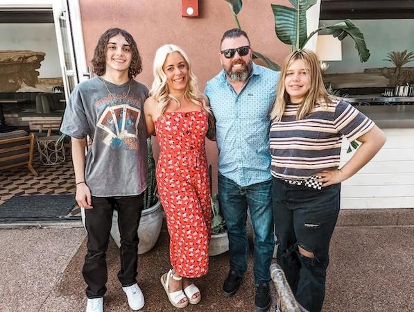 Kayla shown with her family.