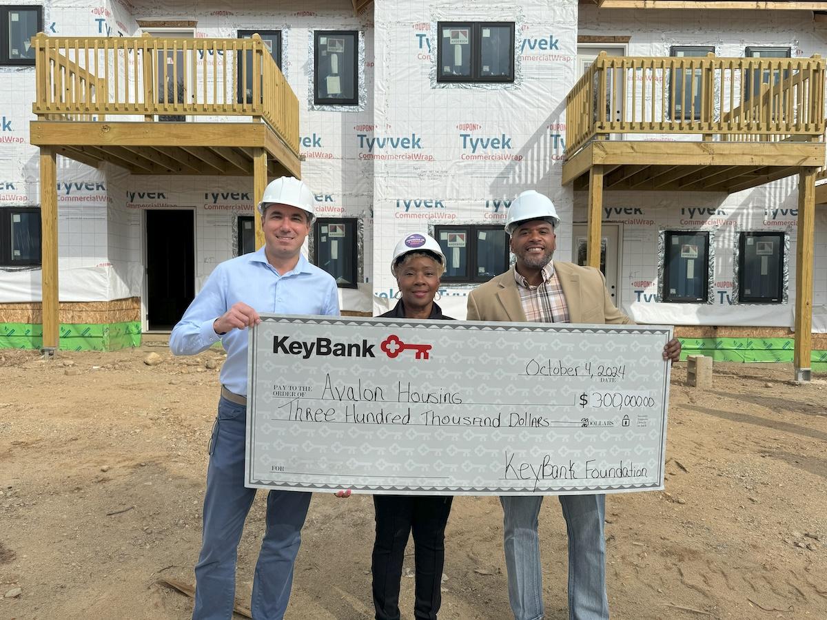 KeyBank and Avalon Housing representatives shown with a $300,000 grant check.