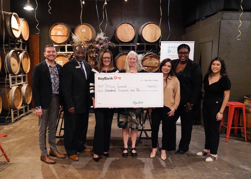 KeyBank and Proud Ground Team shown with check for $400,000.