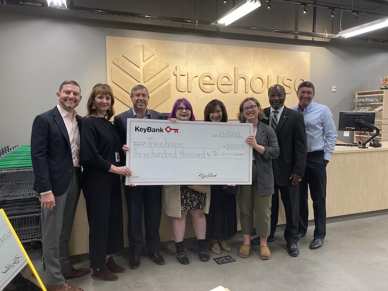 Group photo with large check