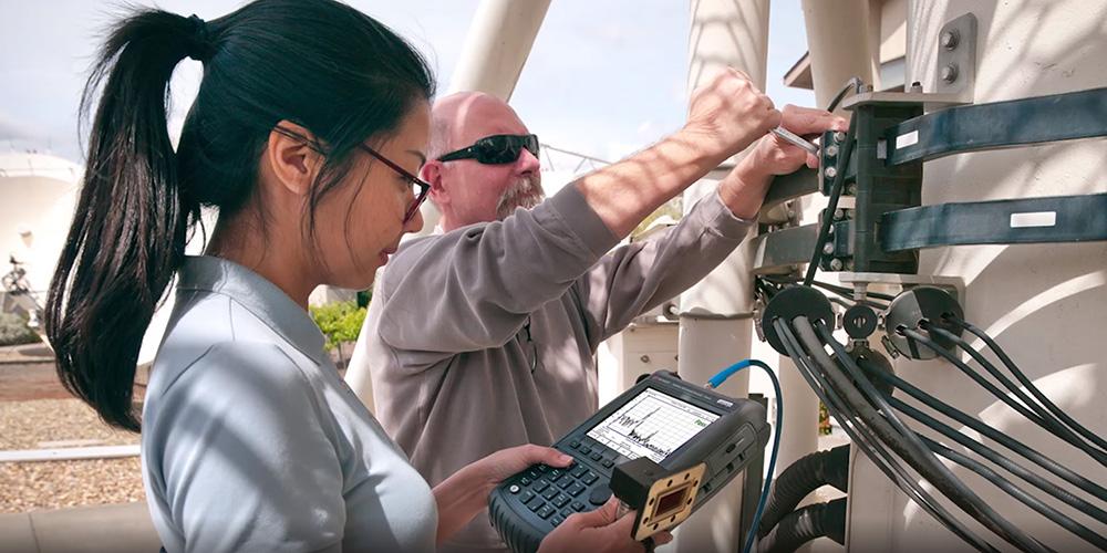 Man and woman working with Keysight Technologies equipment