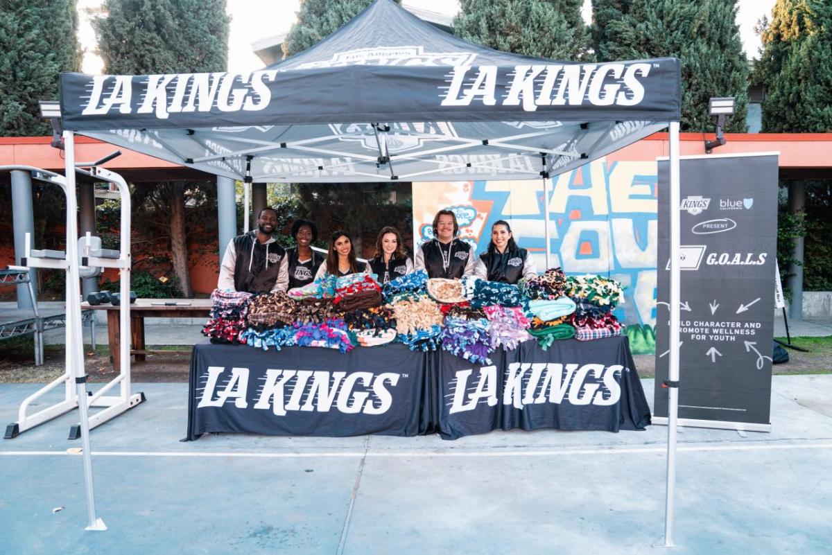 LA Kings staff distributing blankets under a tent