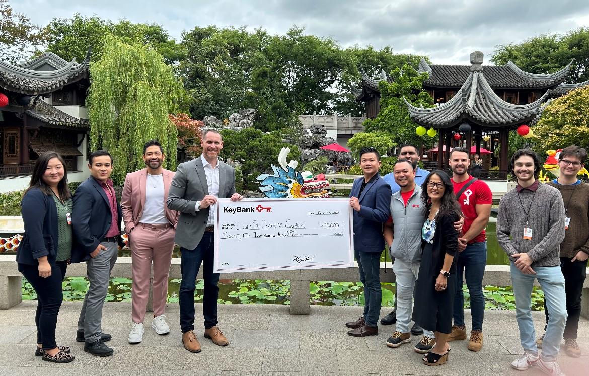 KeyBank and Lan Su teams accepting the grant check for $25,000. 