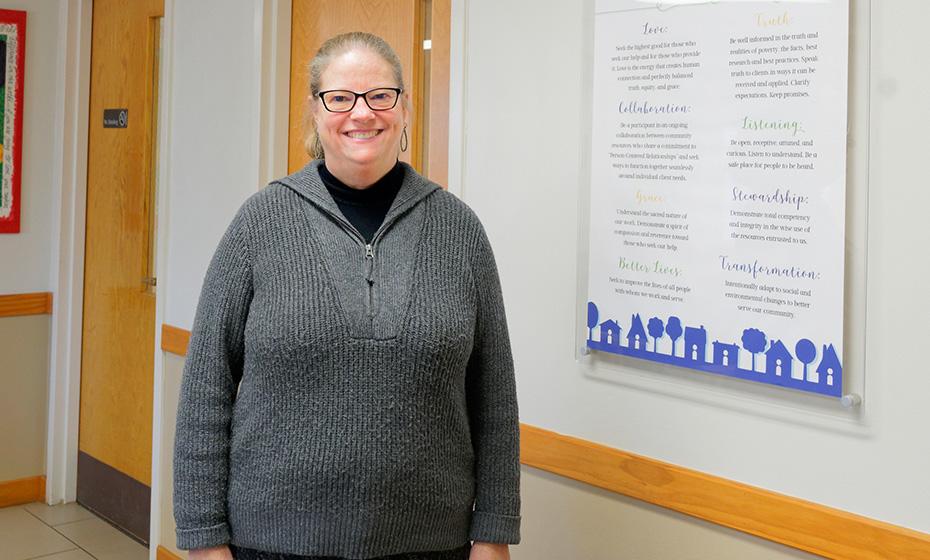 Margaret Elliott  stood in a hallway