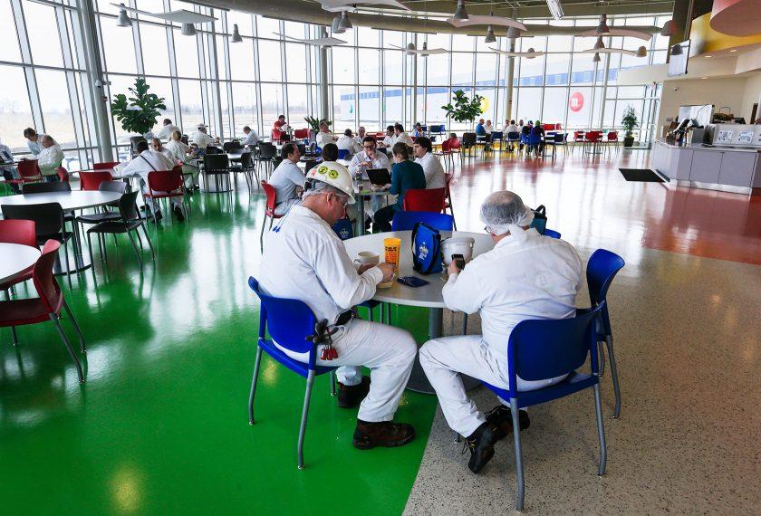 people sitting in a cafeteria 