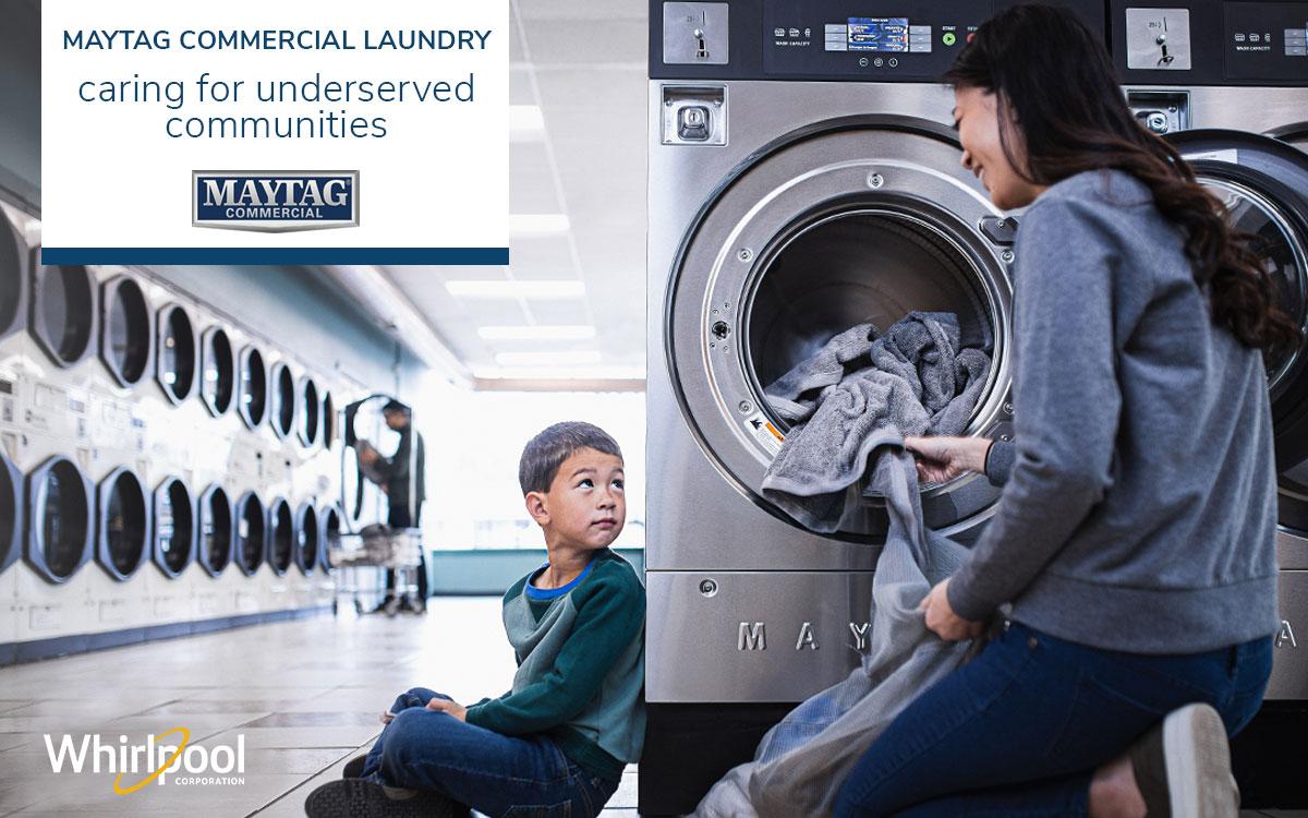 Mom and child doing laundry at a laundromat