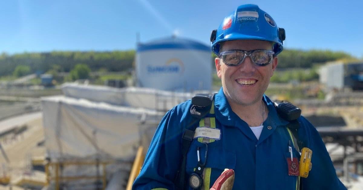 Michael Vickers in suncor uniform and safety gear.