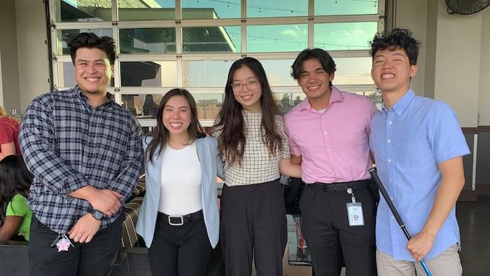 Five NRG Interns shown in an office.