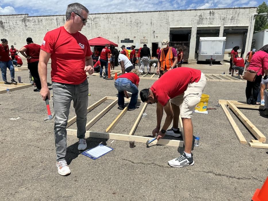 KeyBank volunteers shown building a home.