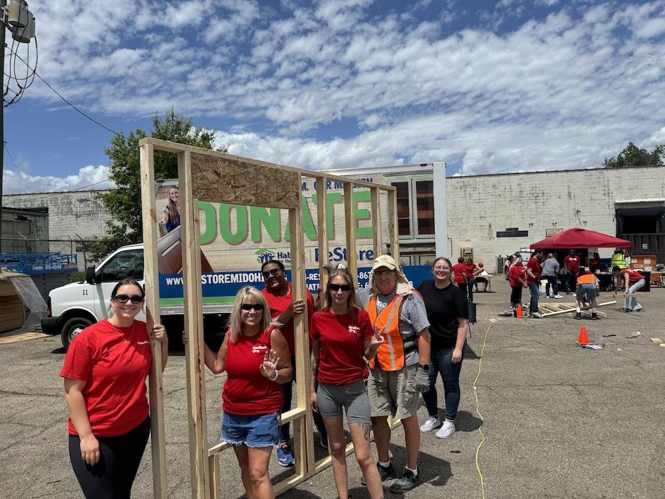 KeyBank volunteers with a completed frame.