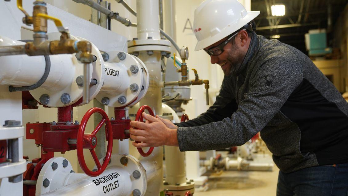 employee turning wheel at PFAS cetner