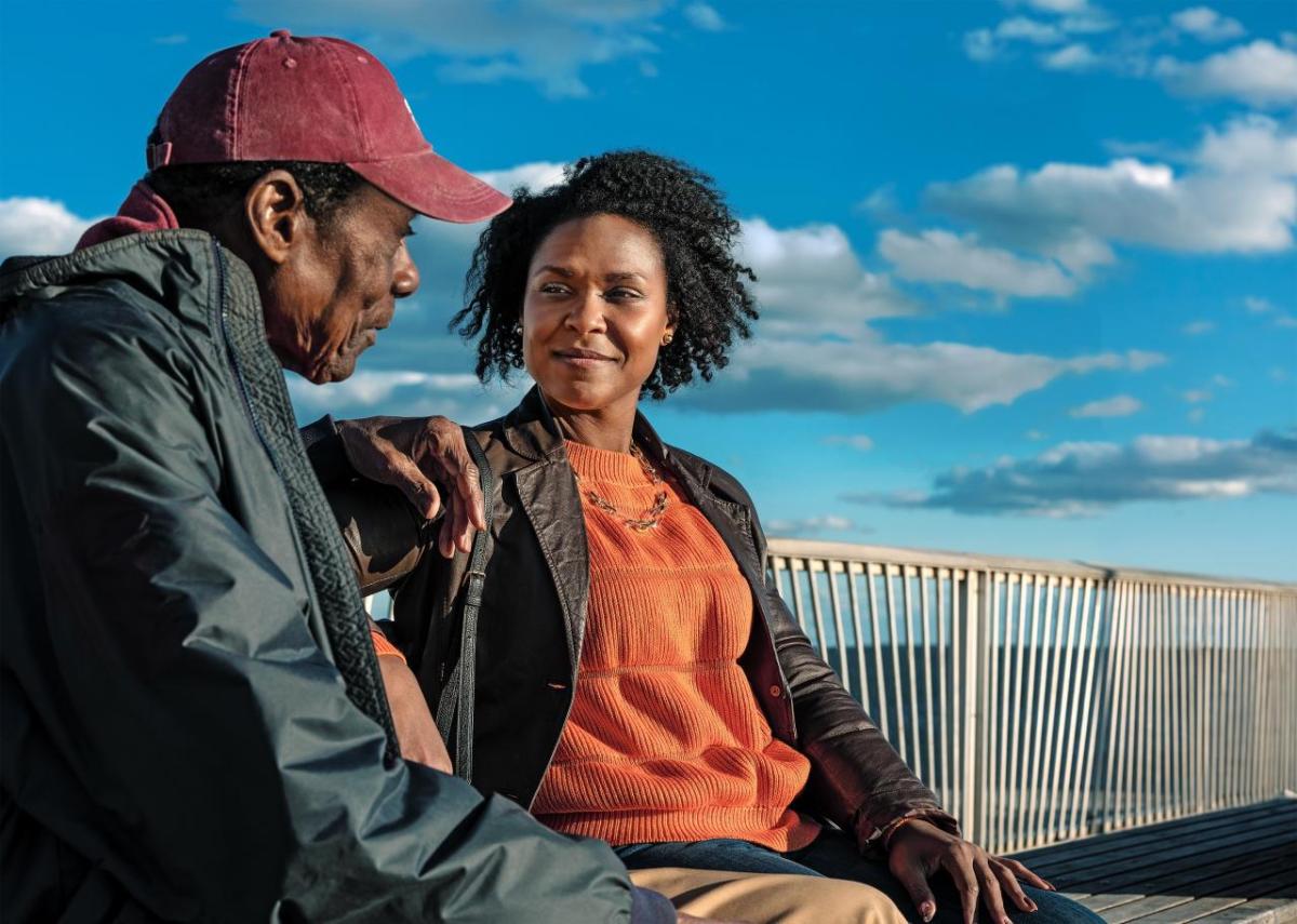 Two people sat on a bench