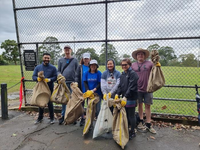 Earth Day volunteers from Nielsen posing for a photo.