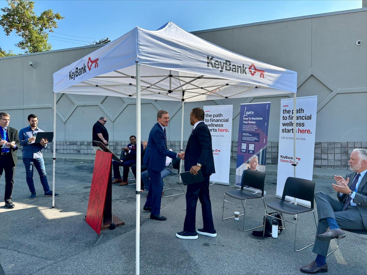 KeyBank CEO, Chris Gorman, and Operation HOPE CEO John Hope Bryant shake hands.