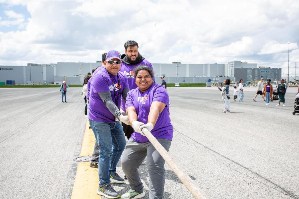 Volunteers play tug-of-war