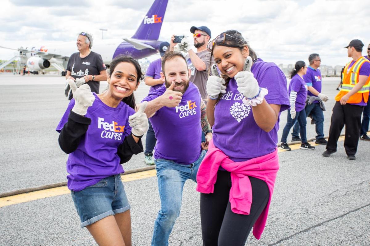 Volunteers in FedEx Cares shirts