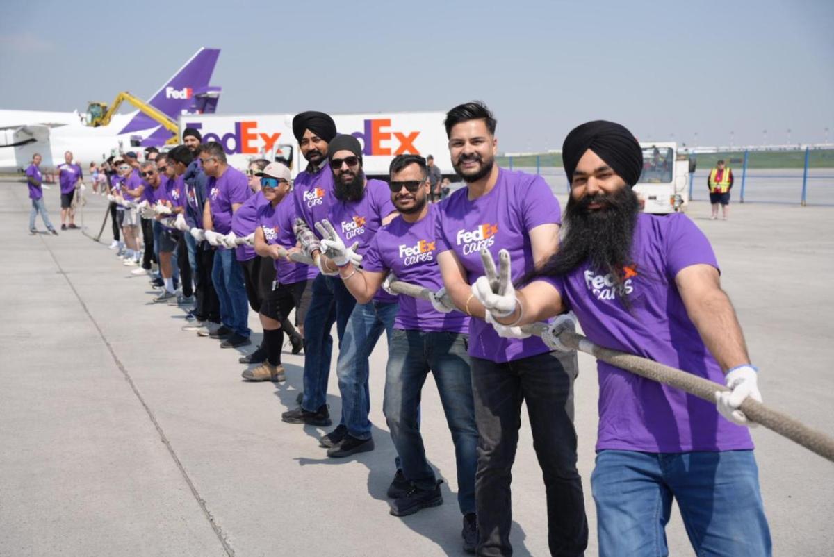 Volunteers play tug-of-war