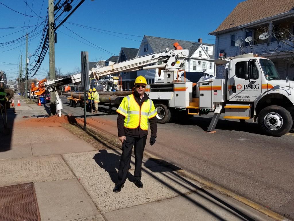 Photo of PSEG employee in protective gear in the field.