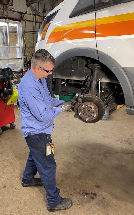 Photo: Delran Fire Chief Kevin Peak replacing brakes.