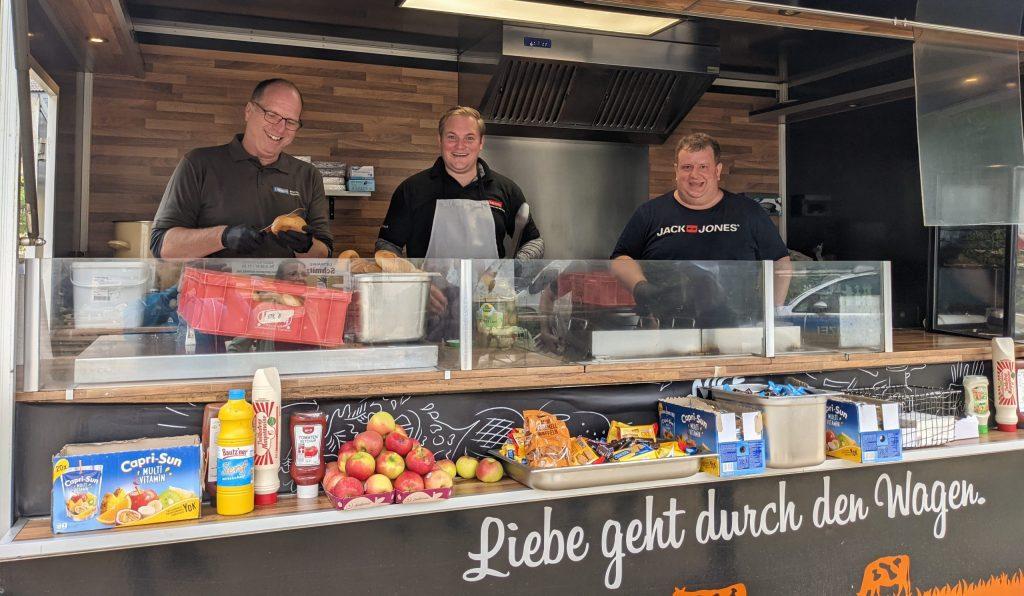 Employees serving food at a food truck