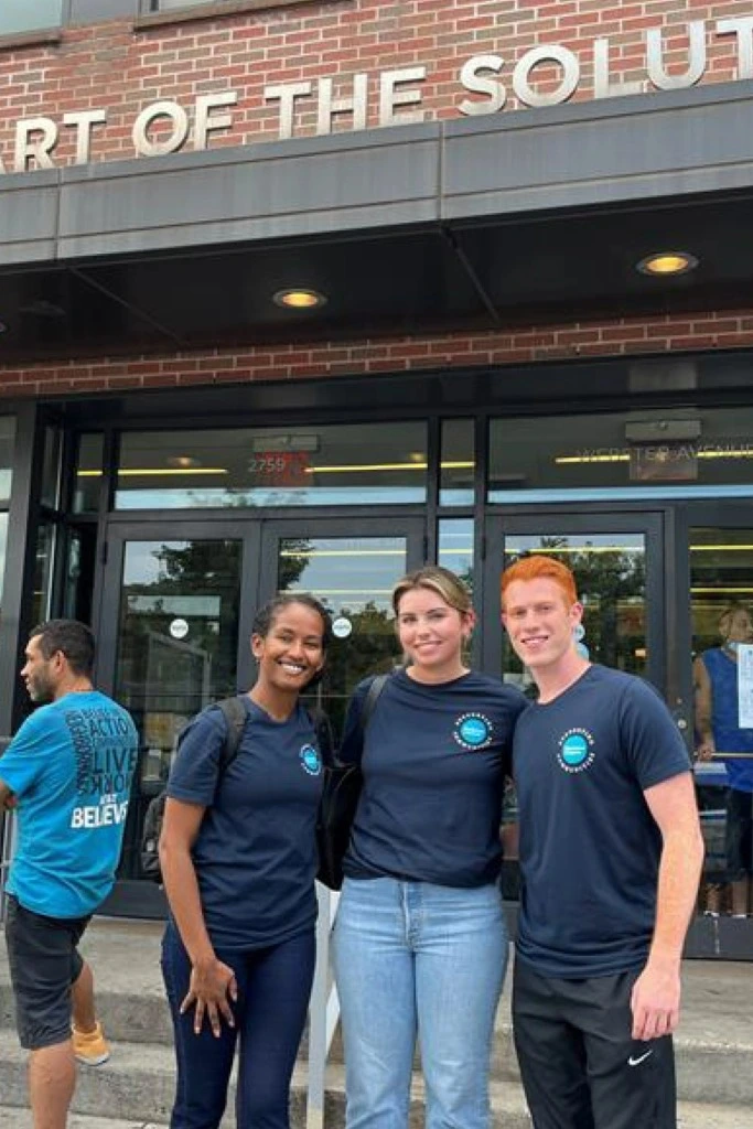 Three volunteers at Part of the Solution