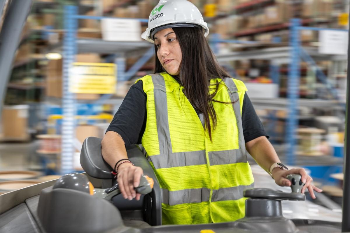 Wesco employee operating a forklift.