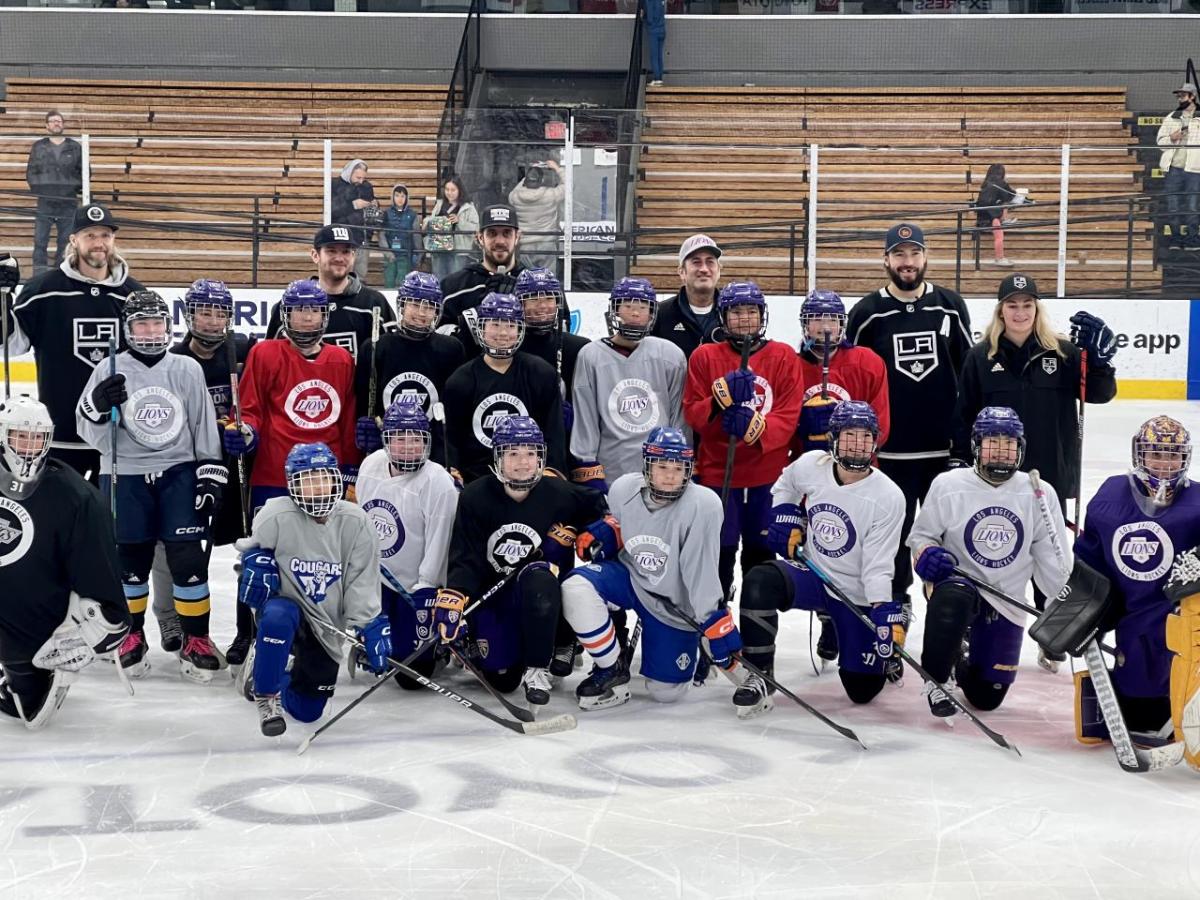 LA Kings players pose with youth hockey players from LA Lions.