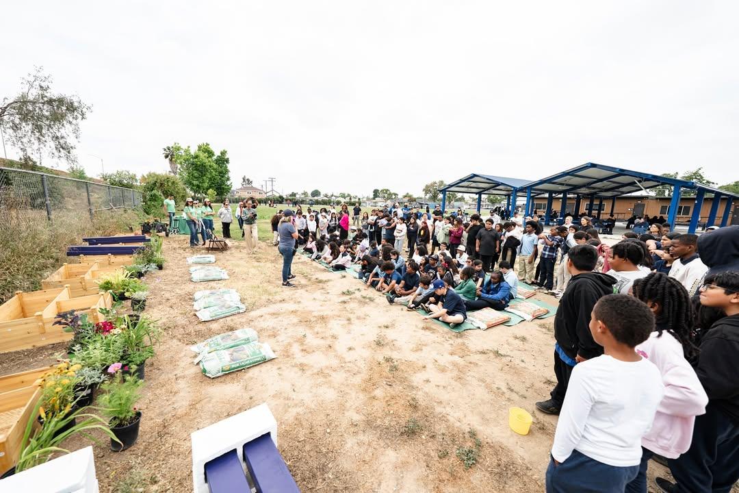 Students joined alongside volunteers to help transform the school's garden into a vibrant learning environment.