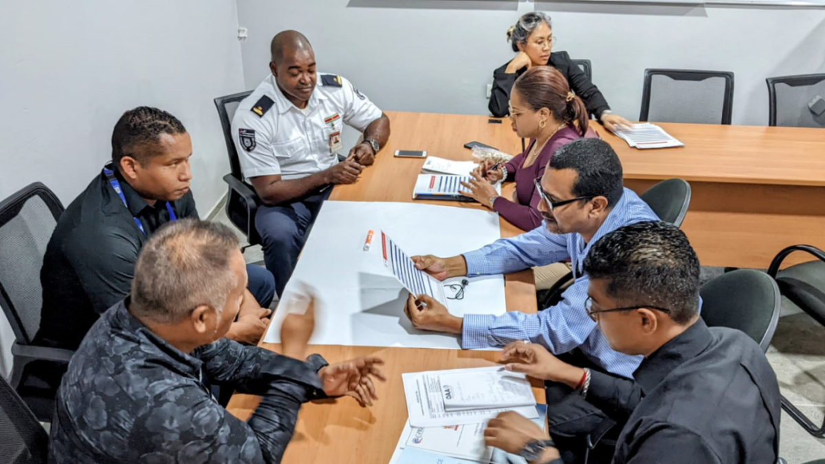 Group of seven people participating in tabletop exercise