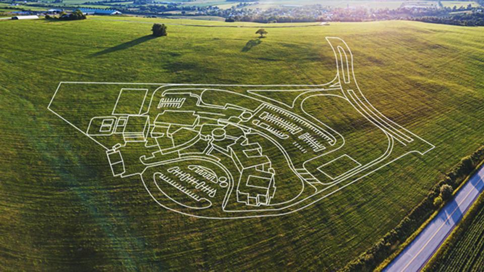 2D drawing of a Tetra Tech master plan for a wastewater treatment overlaying an aerial photo of a field.